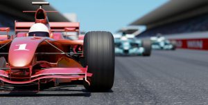 Close front view of a red race car on a track. High resolution 3D render.
